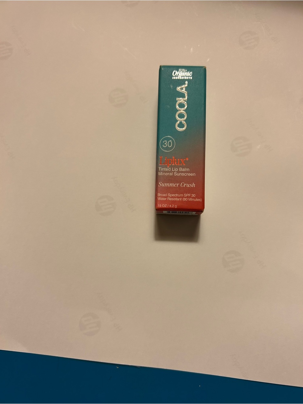 COOLA Liplux Tinted Lip Balm SPF 30 - Teal and Coral Packaging
